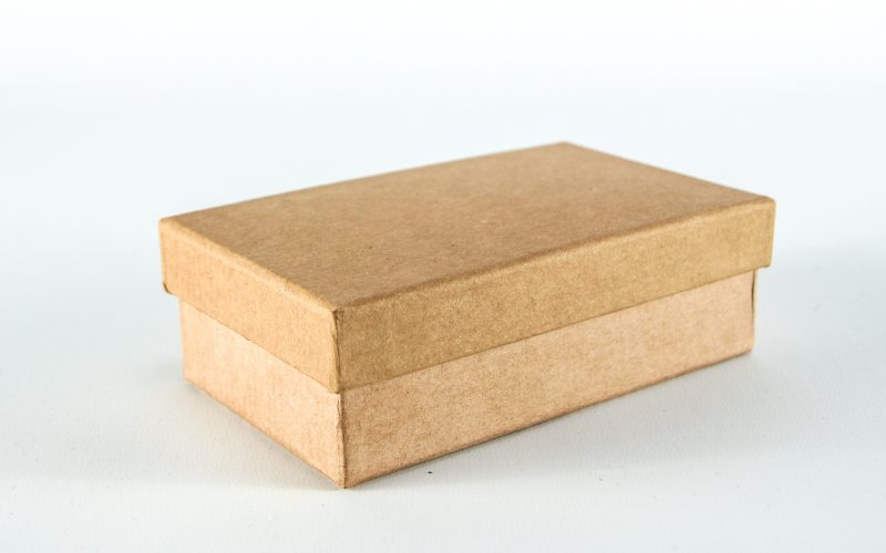 brown cardboard box on white surface