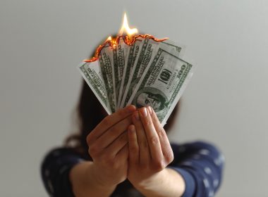 a fan of fake American dollars on fire