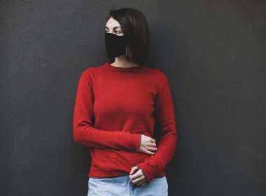 woman in red sweater and blue denim jeans