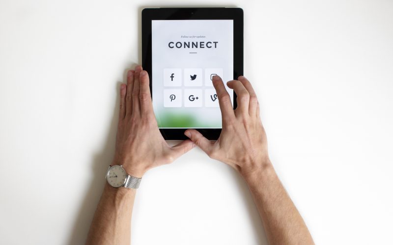 person using black iPad