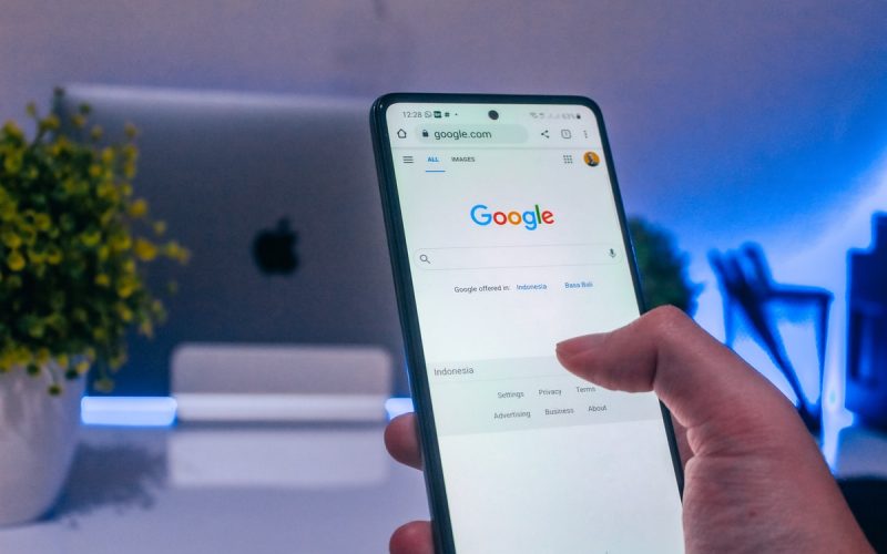person holding white android smartphone