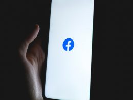 white apple device with blue logo