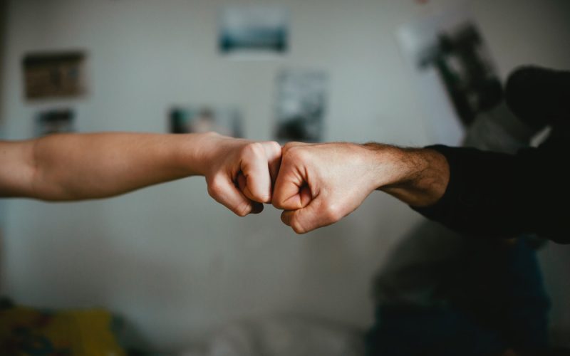 person holding babys hand