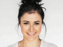 woman in white crew neck shirt smiling