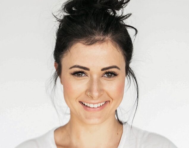 woman in white crew neck shirt smiling